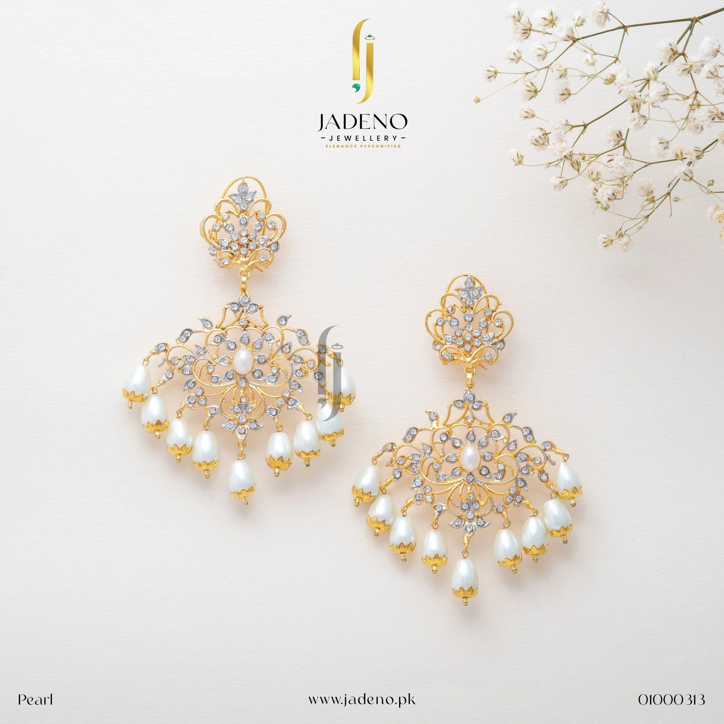 Stunning Sunflower Earrings in pearl with ruby center stone and pista drop beads. Perfect for weddings and festive occasions. Available at JADENO