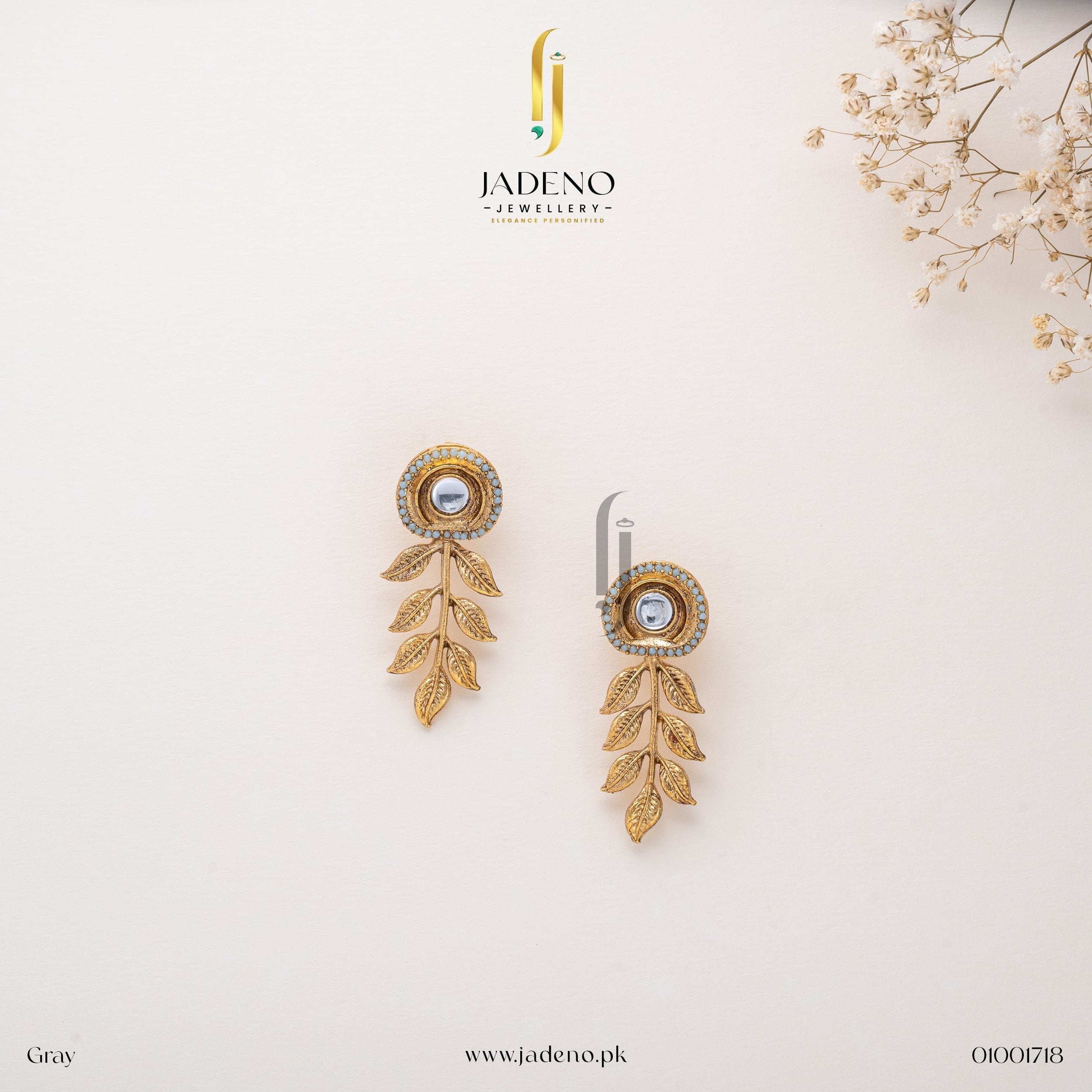 "Gray Resplendent Egyptian Leaf Earring Studs with golden leaves and a central stone. Perfect for formal and festive occasions. Available at JADENO"