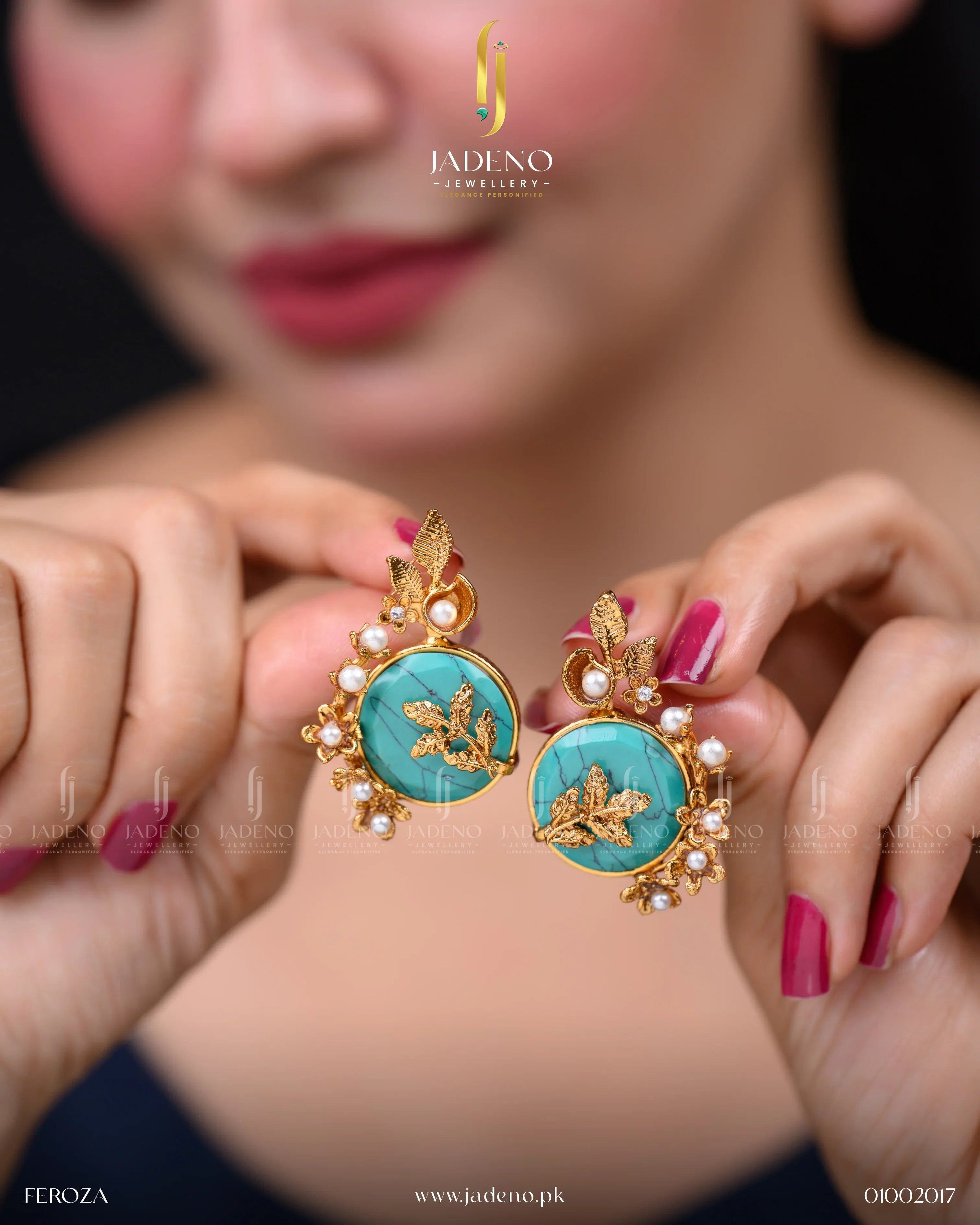 "Hands holding artificial stone earrings with turquoise center and pearl detailing"