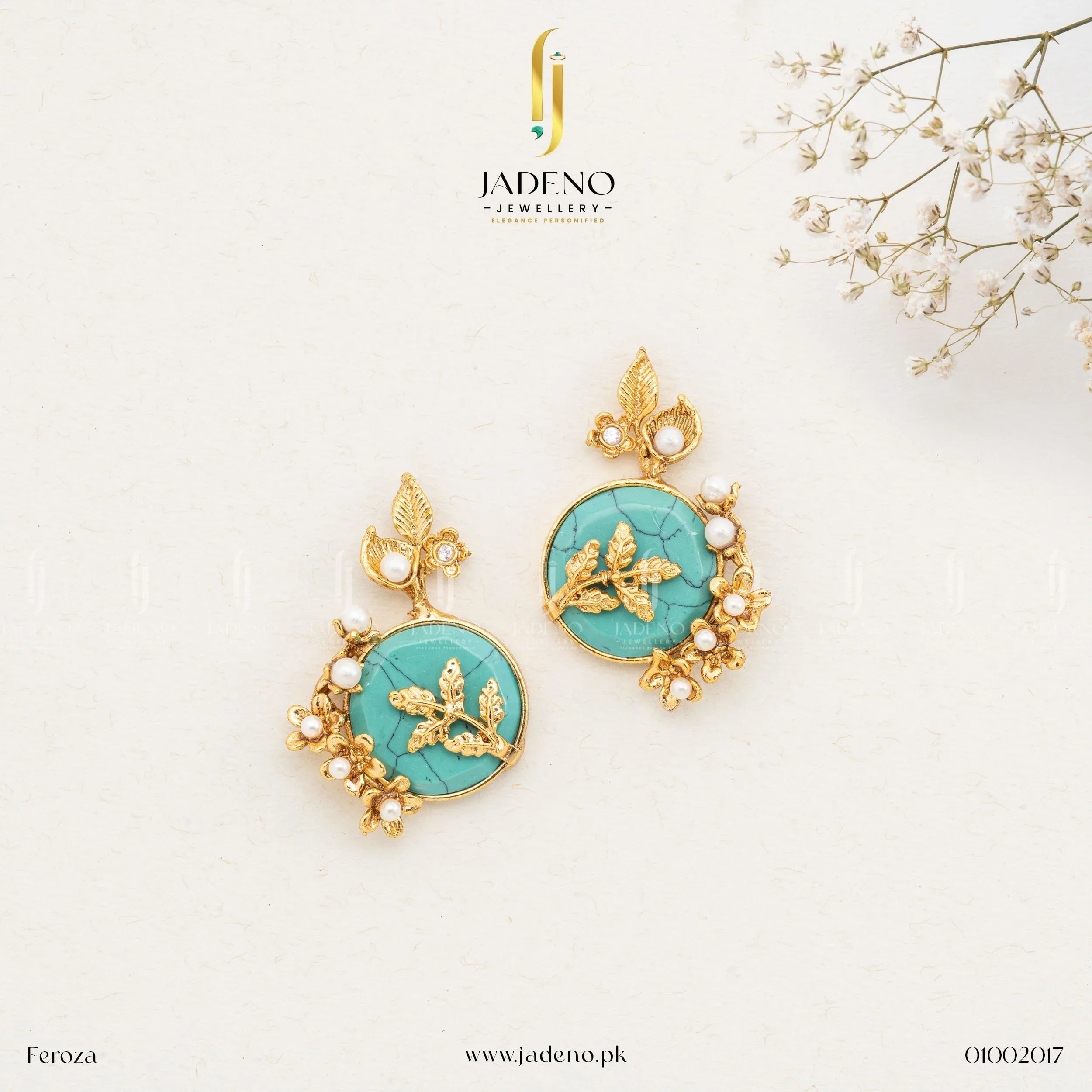 "Artificial stone earrings with turquoise center and pearl detailing on gold finish"