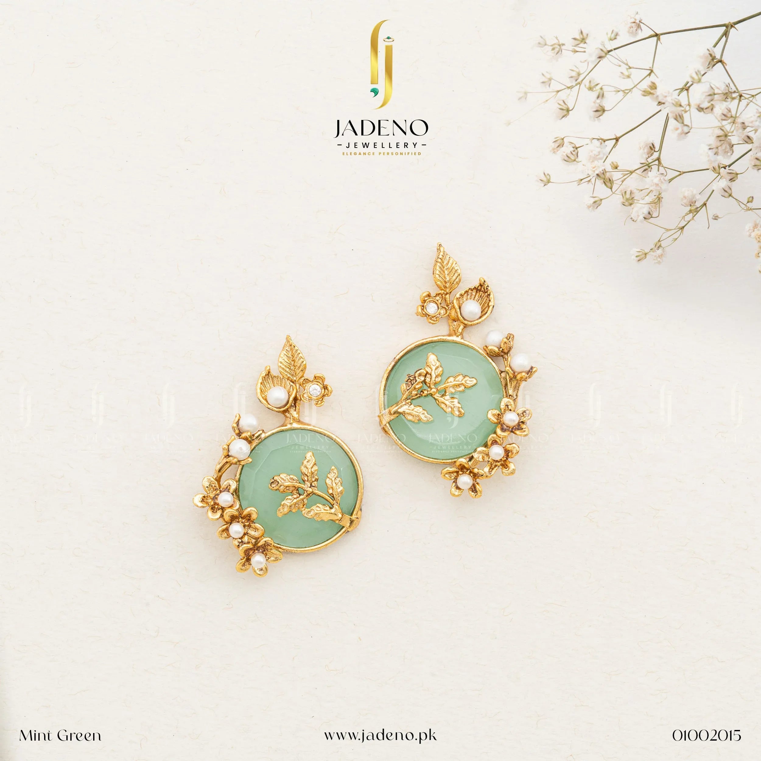 "Stylish artificial earrings design featuring green stone and pearls"