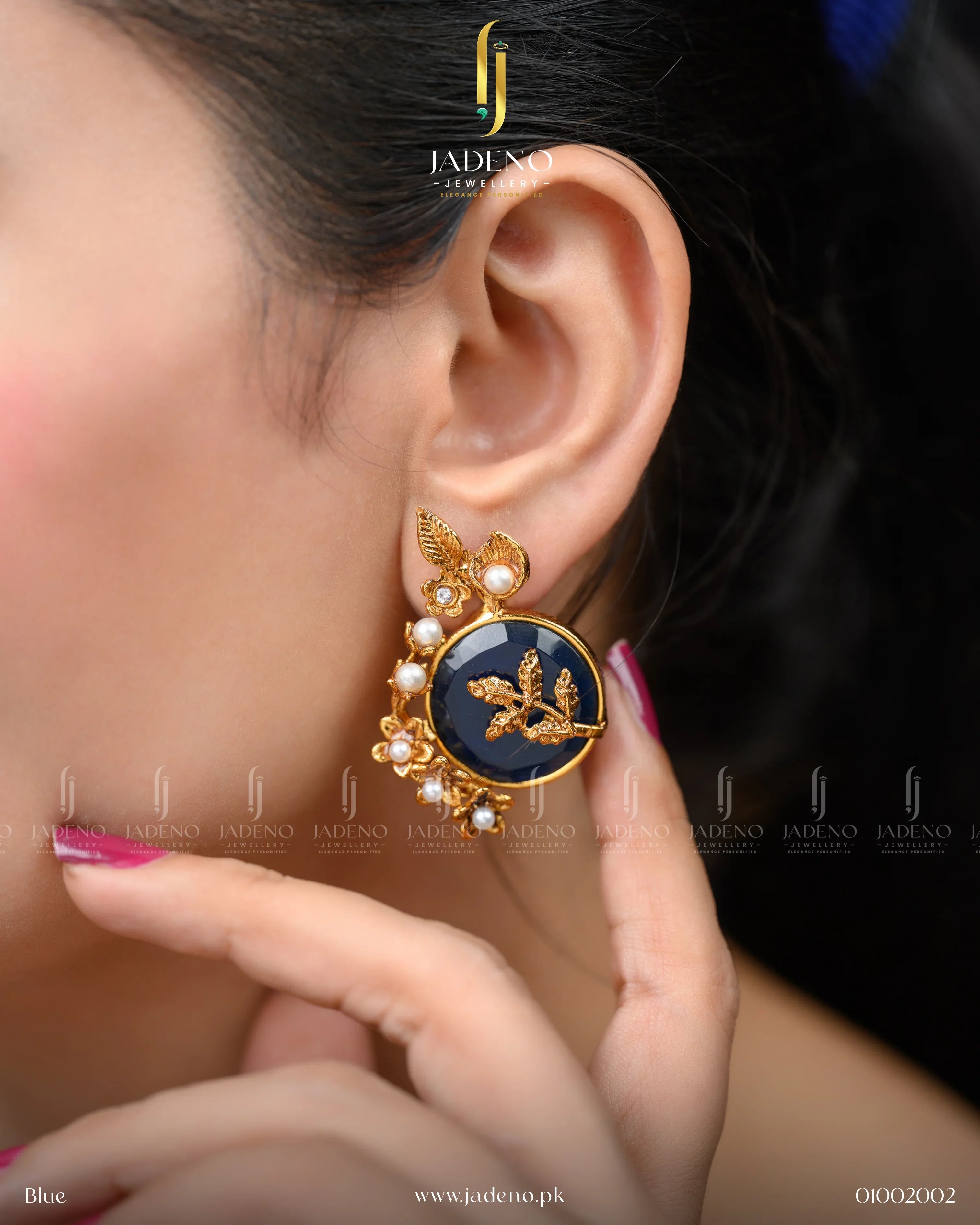 "Stylish artificial earrings design with blue stone shown worn on ear"