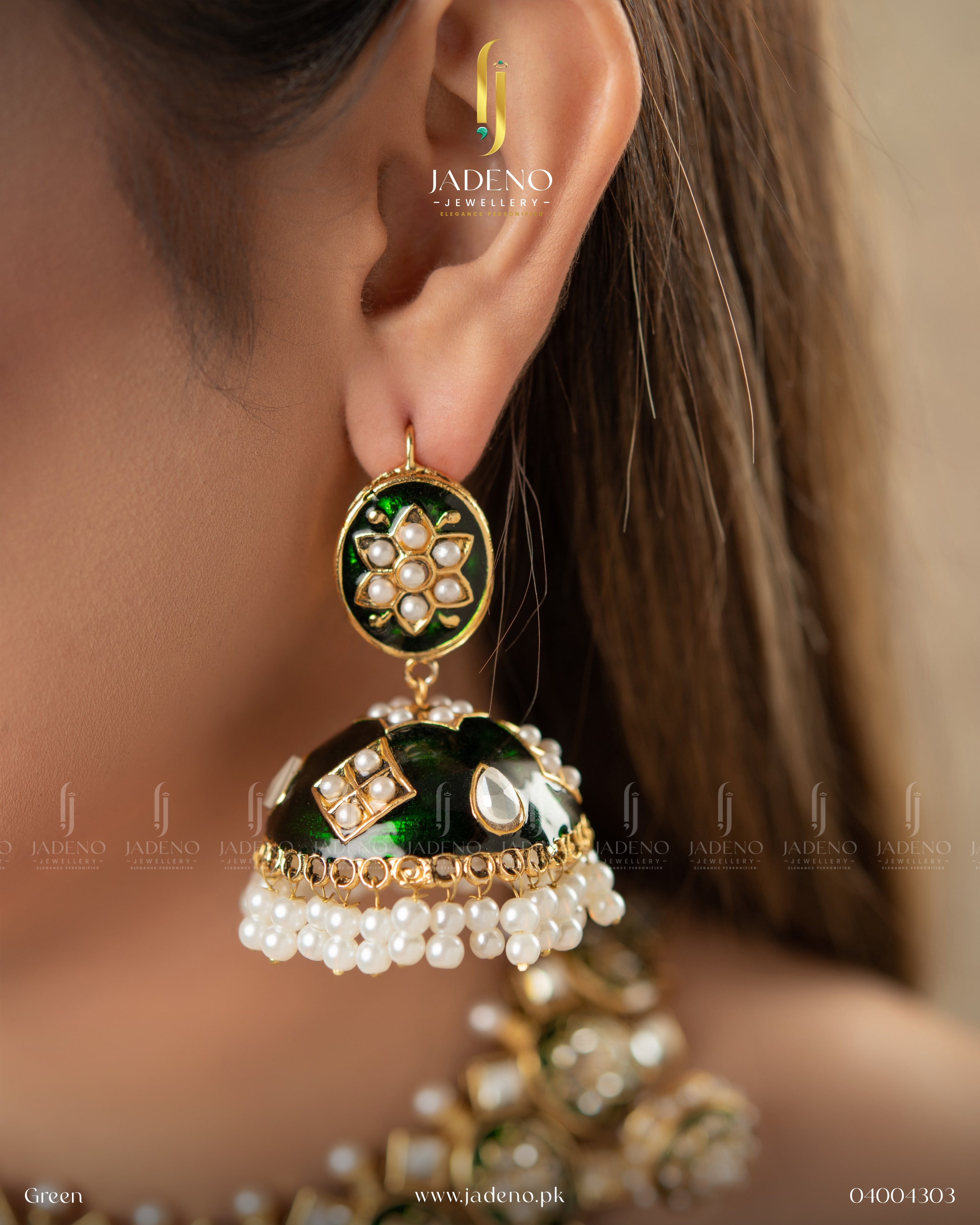 "Side view of green kundan jhumka earrings worn on ear"