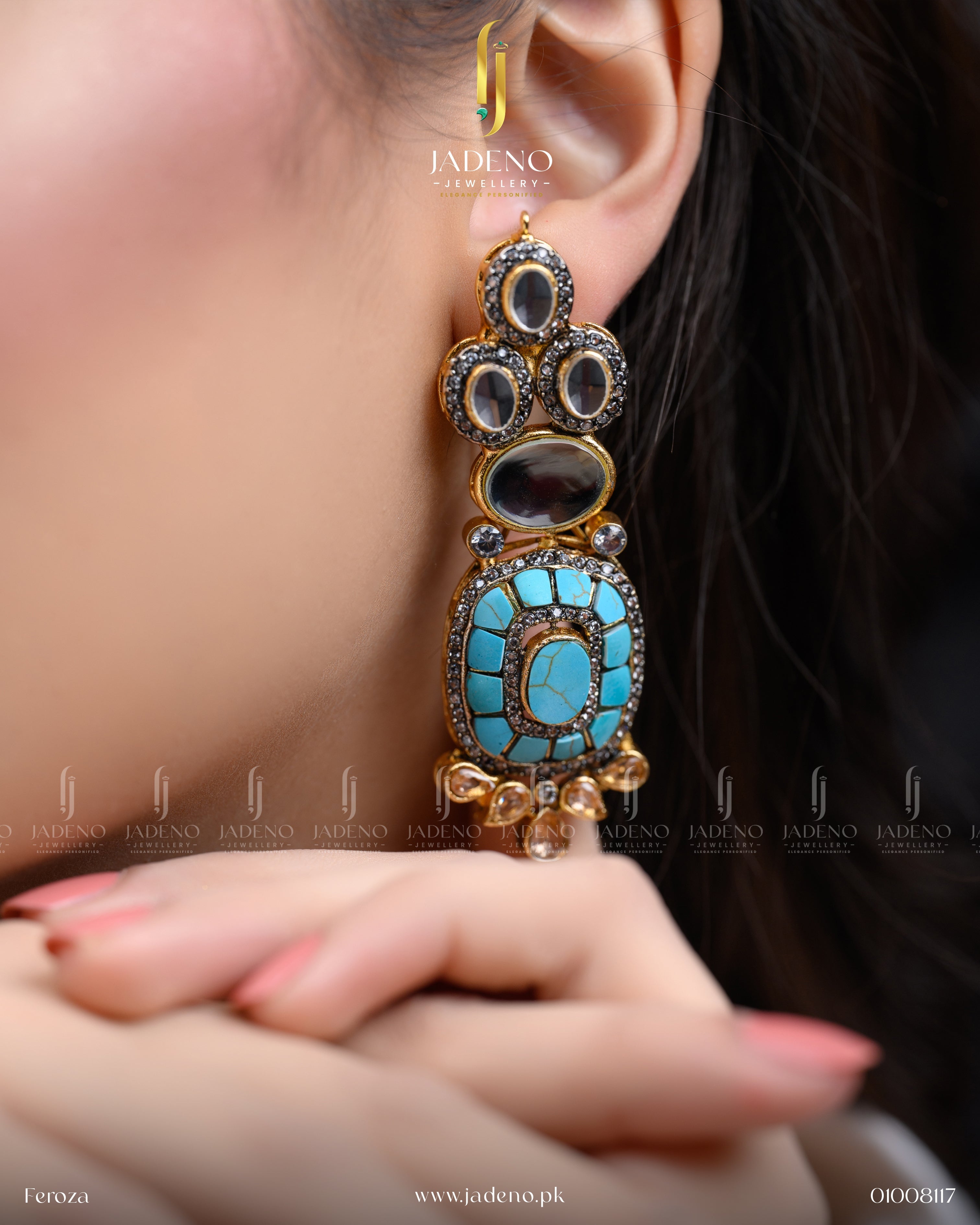"Close-up of a woman wearing fascinating stone cut earrings with turquoise and black stones"
