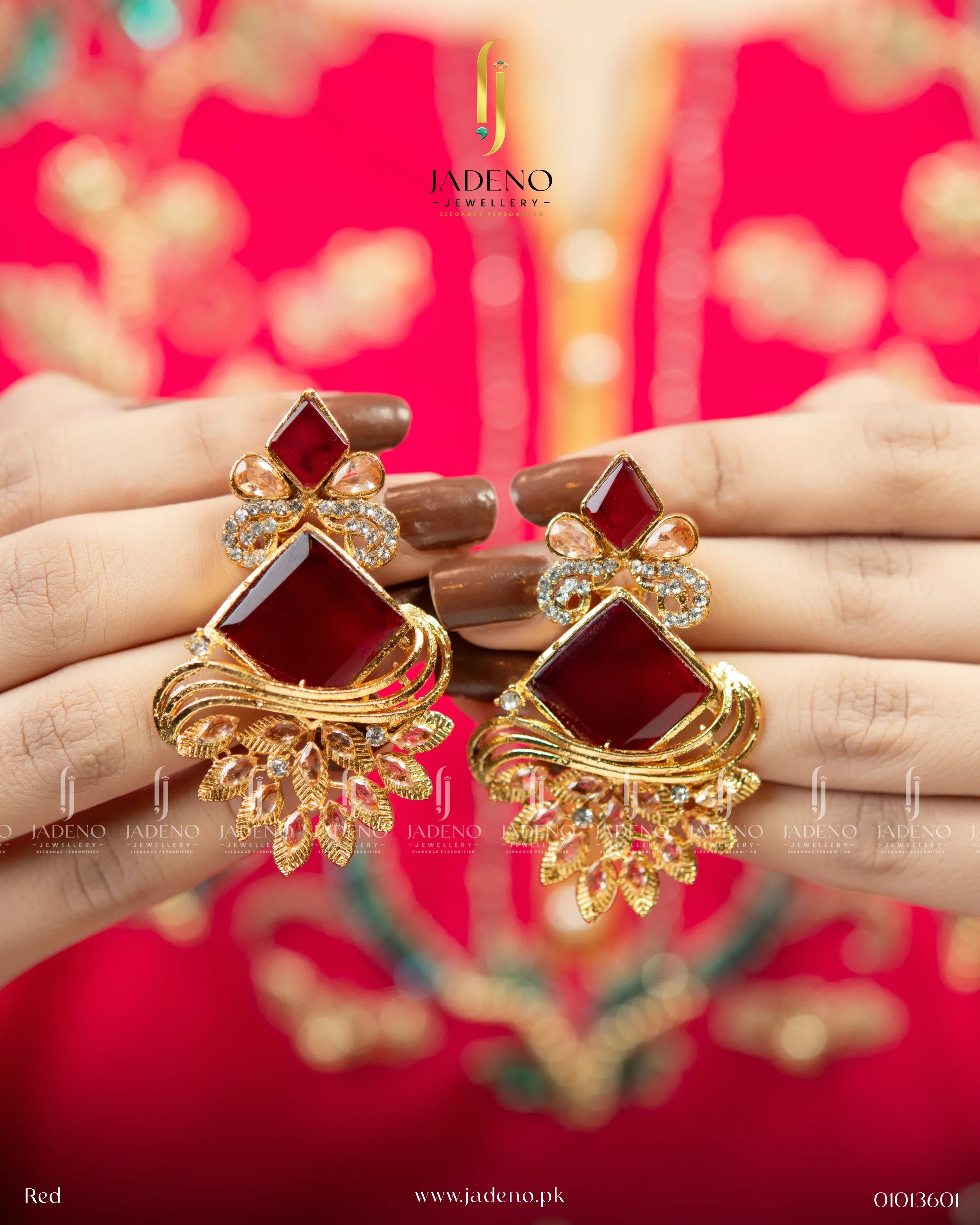 "Bohemia dangle handmade earrings for women with black stone and gold-tone detailing, pair displayed in hand"