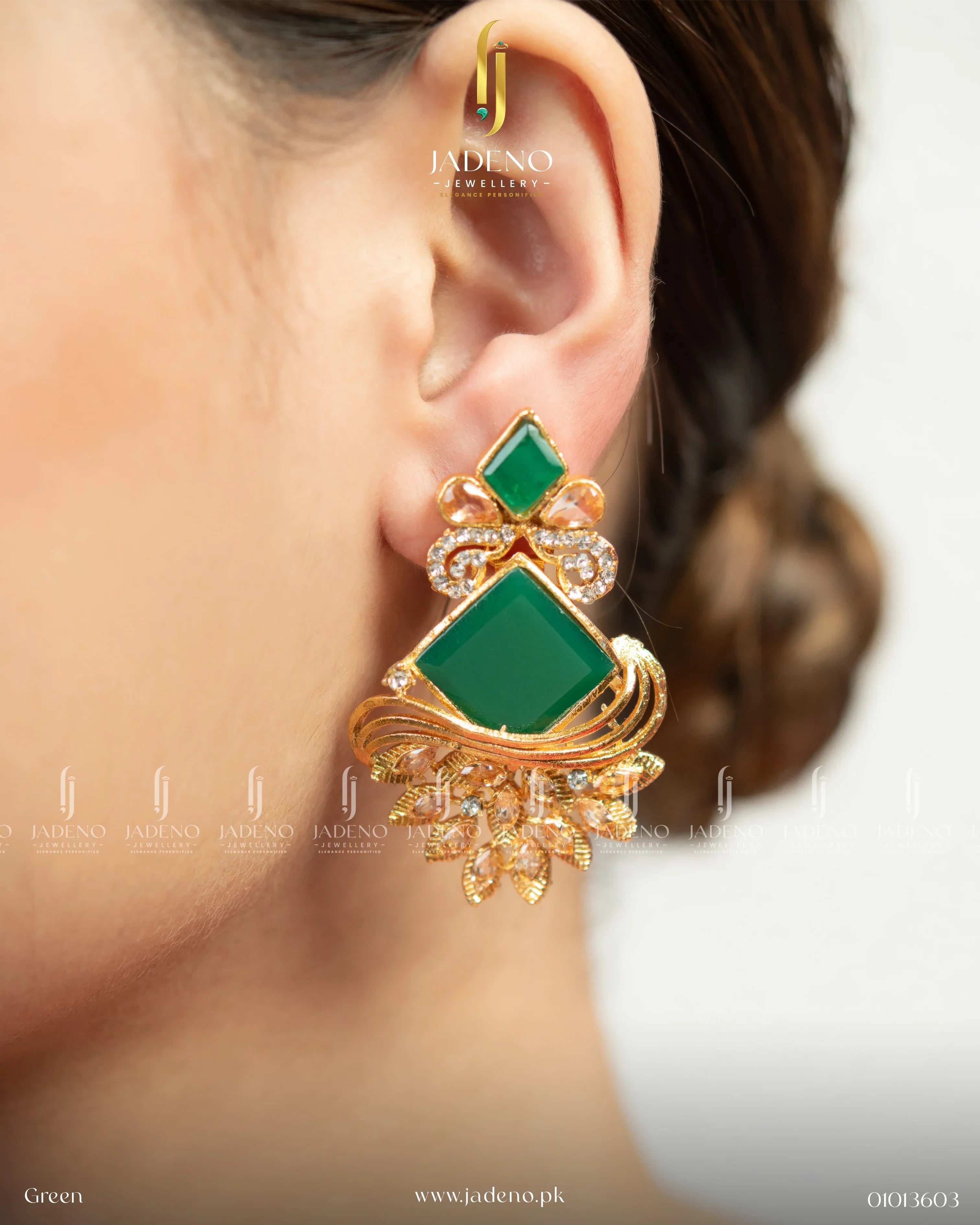 "Green stone bohemia dangle earrings for women worn on ear with gold detailing"