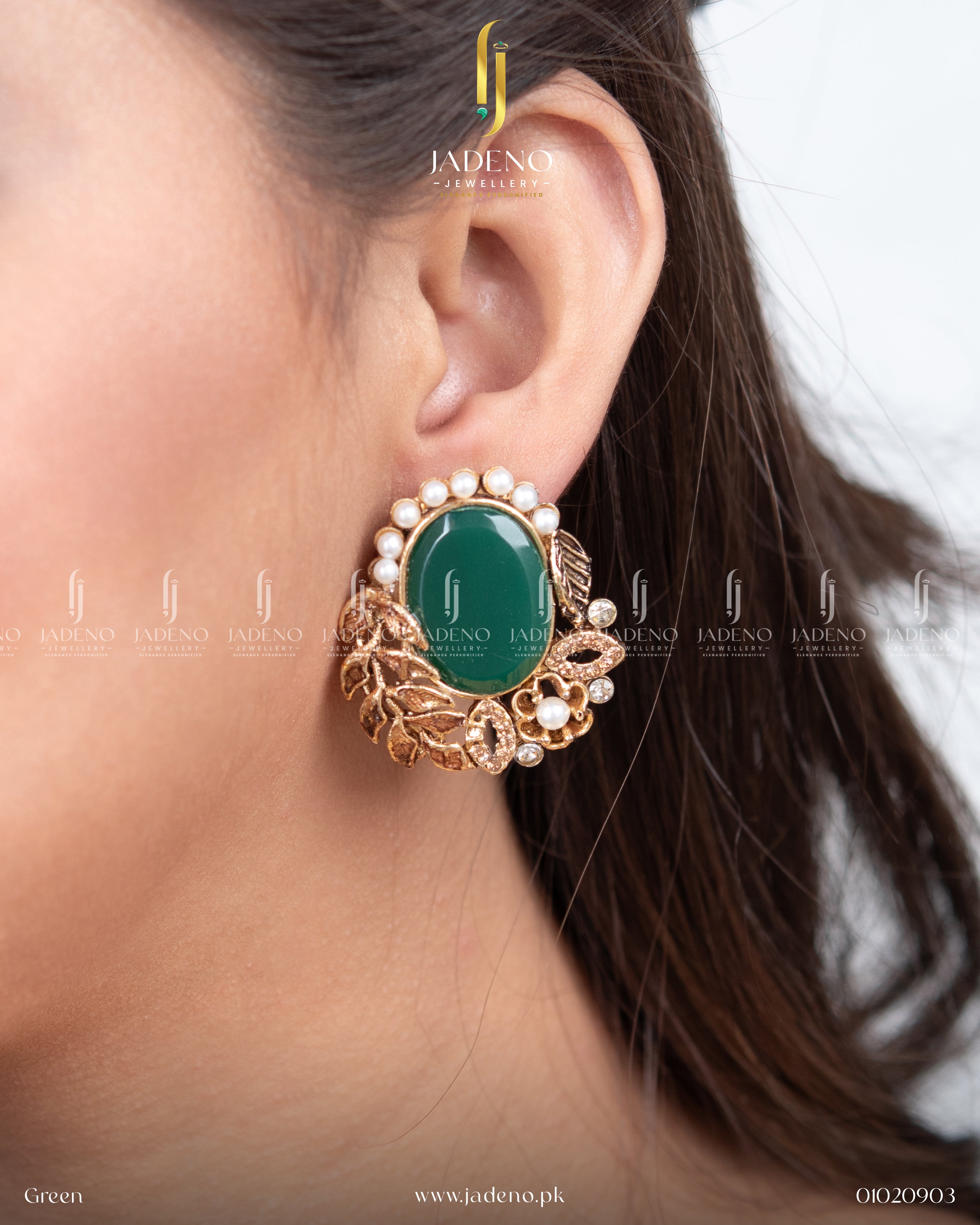 "Elegant green leaf cut earrings for women with pearl detailing worn on ear"