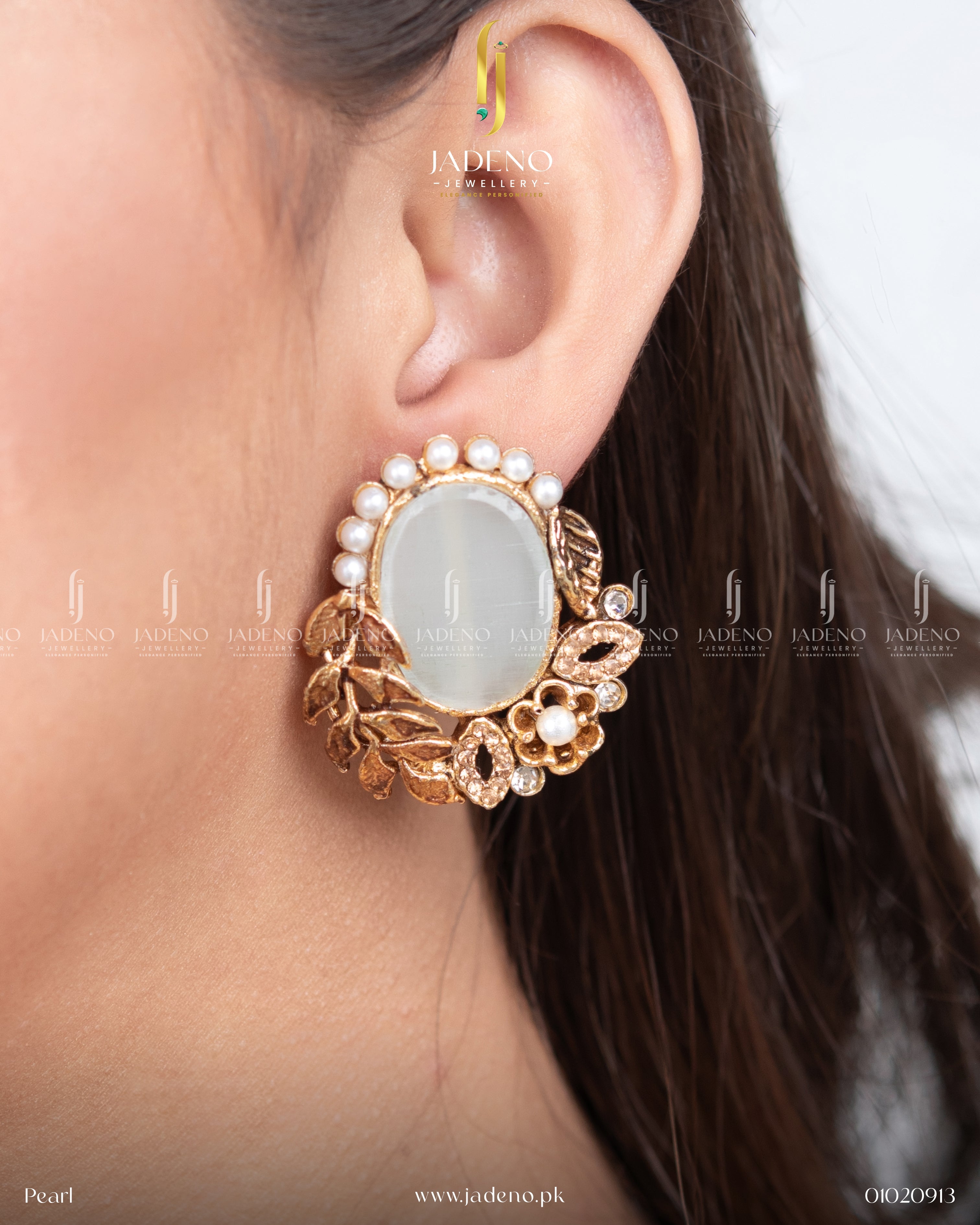 "Woman wearing white stone leaf cut earrings accented with pearls"