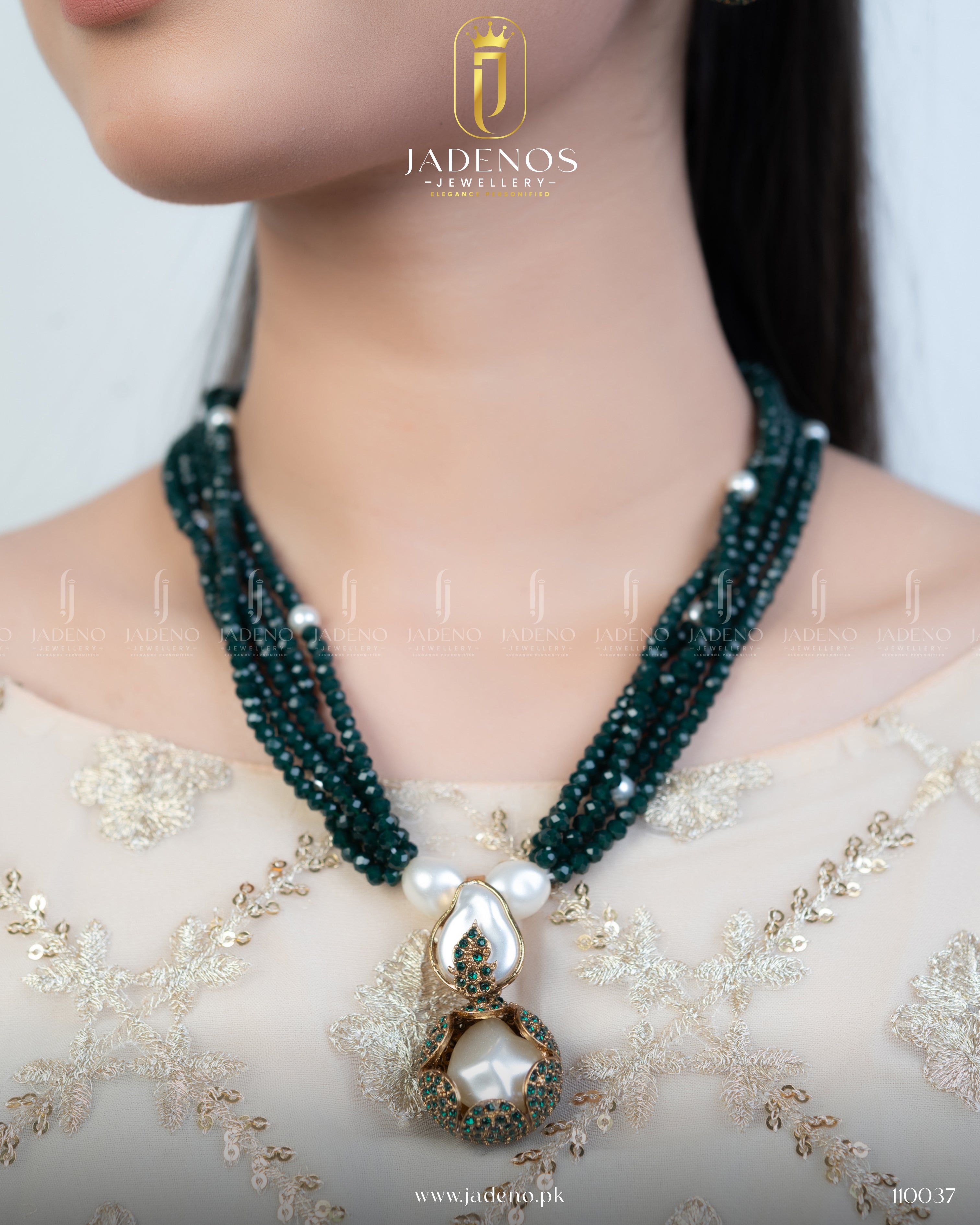 "Model wearing a fancy long mala necklace with green beads"