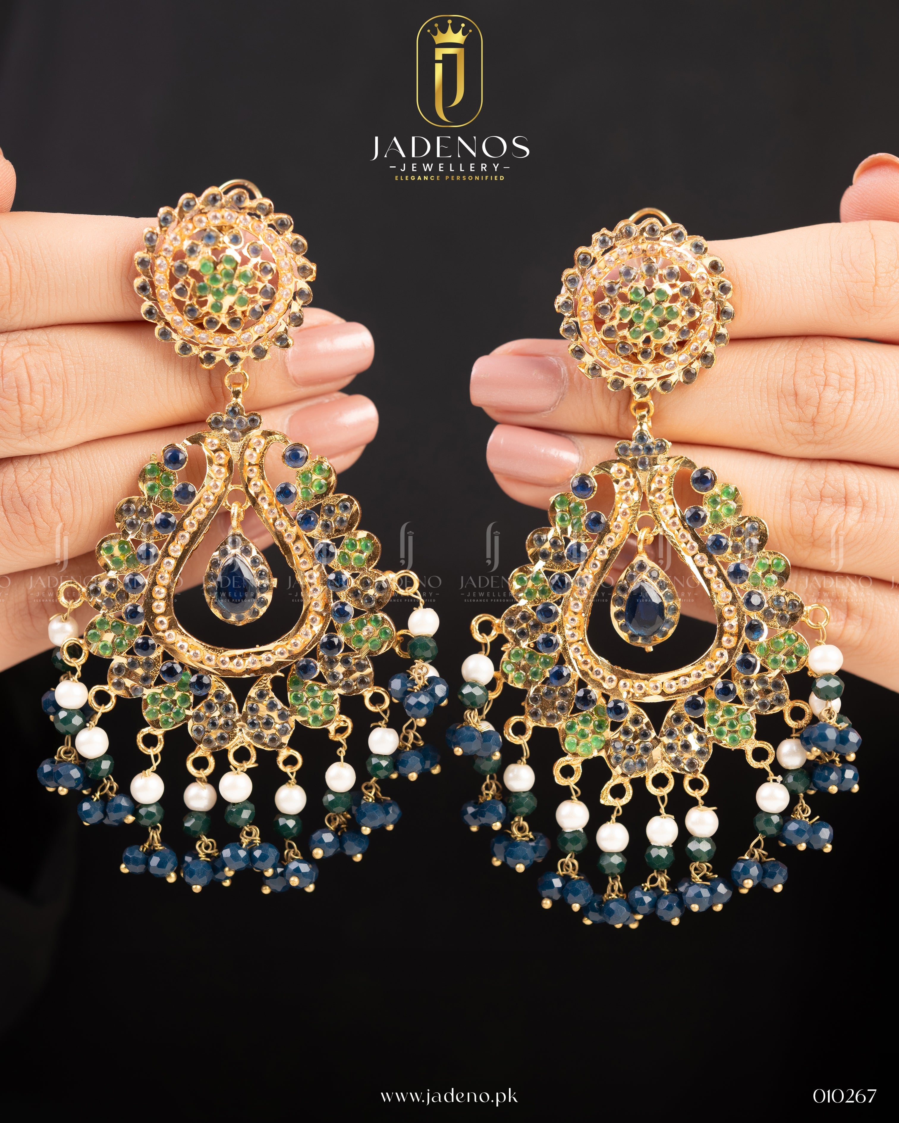 Elegant Sunehri Sitara Earrings featuring multi-colored stones, blue and green teardrop accents, and delicate pearl drops, with a gold-tone finish.A