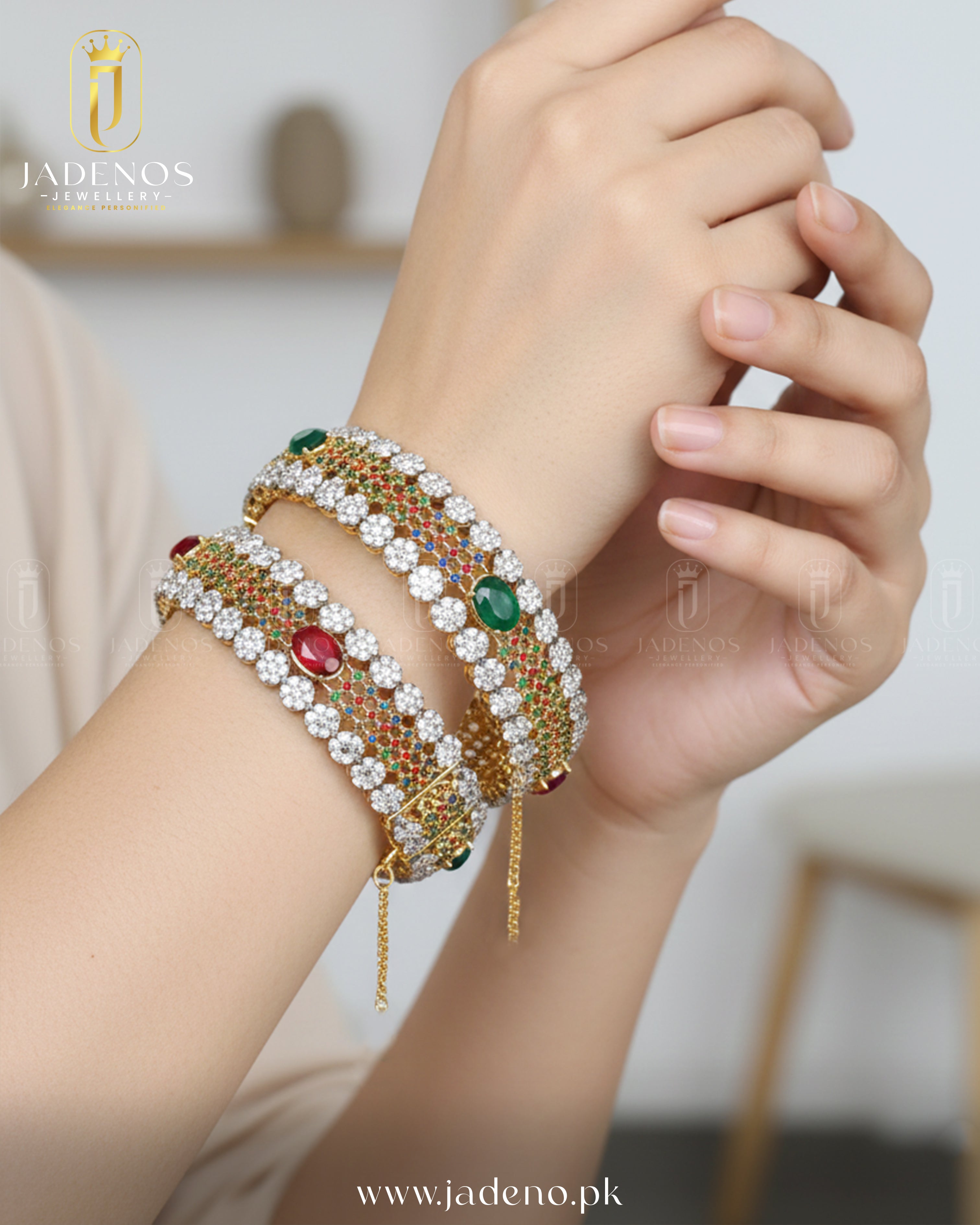 Stylish wrist view of Rang-e-Shahi Openable Bangles with red and green stones, gold base, and sparkling crystal rows.