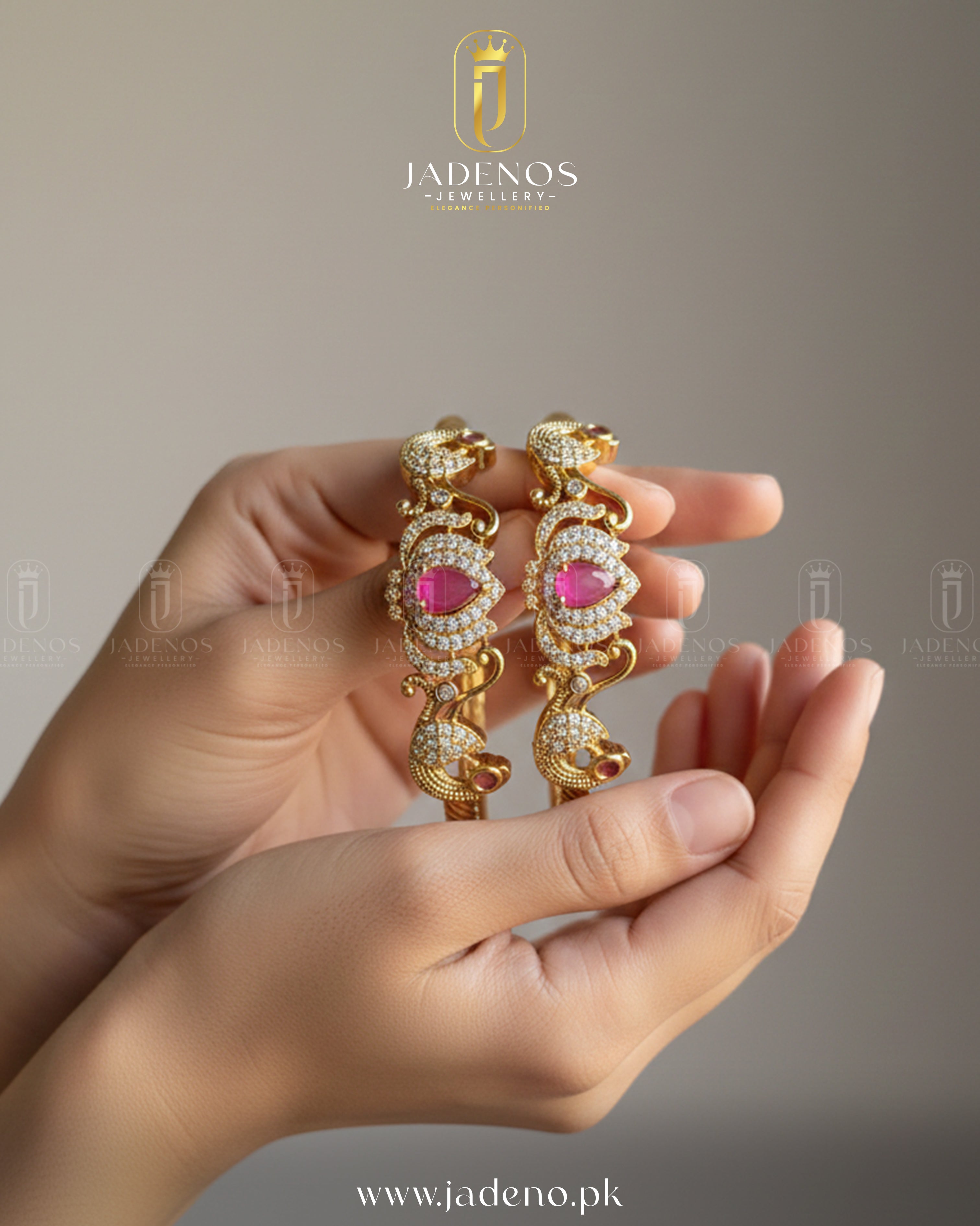 Hands hold Pure Indian Golden Bloom Bangles with pink stones, crystals, and intricate gold design.